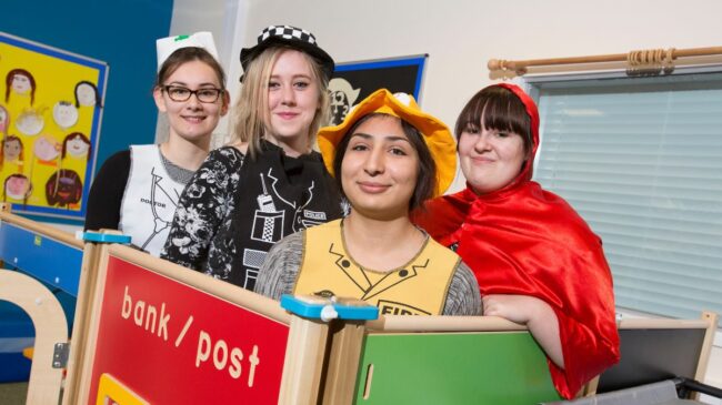 Childcare students playing dress up