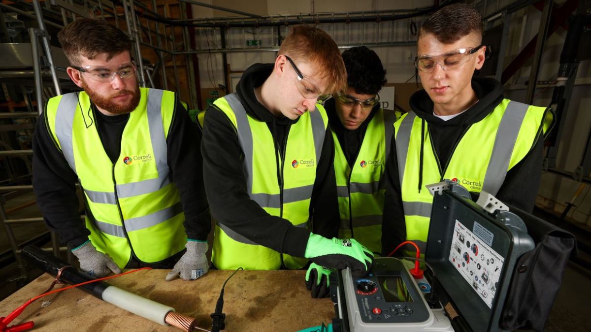 Correll apprentices working on electrical equipment