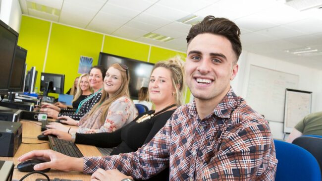 Adult learners on computers
