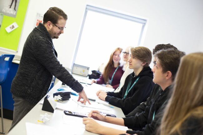 Teacher in classroom with students