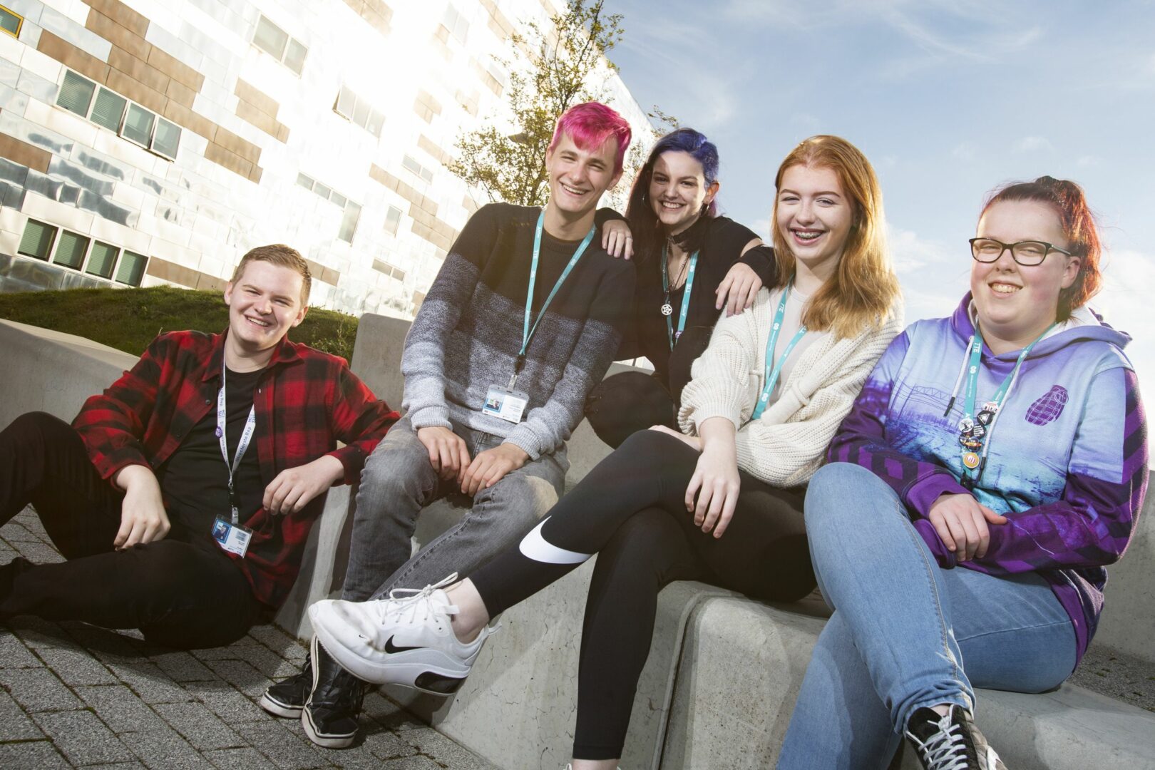 Group of five students sitting outside Middlesbrough College