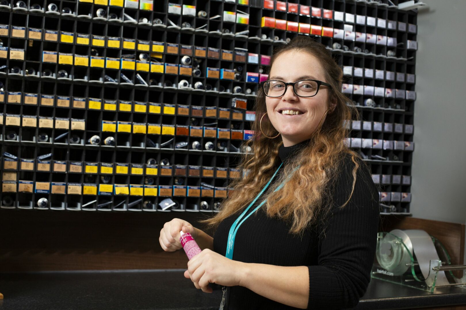 Student with hair dye tubes