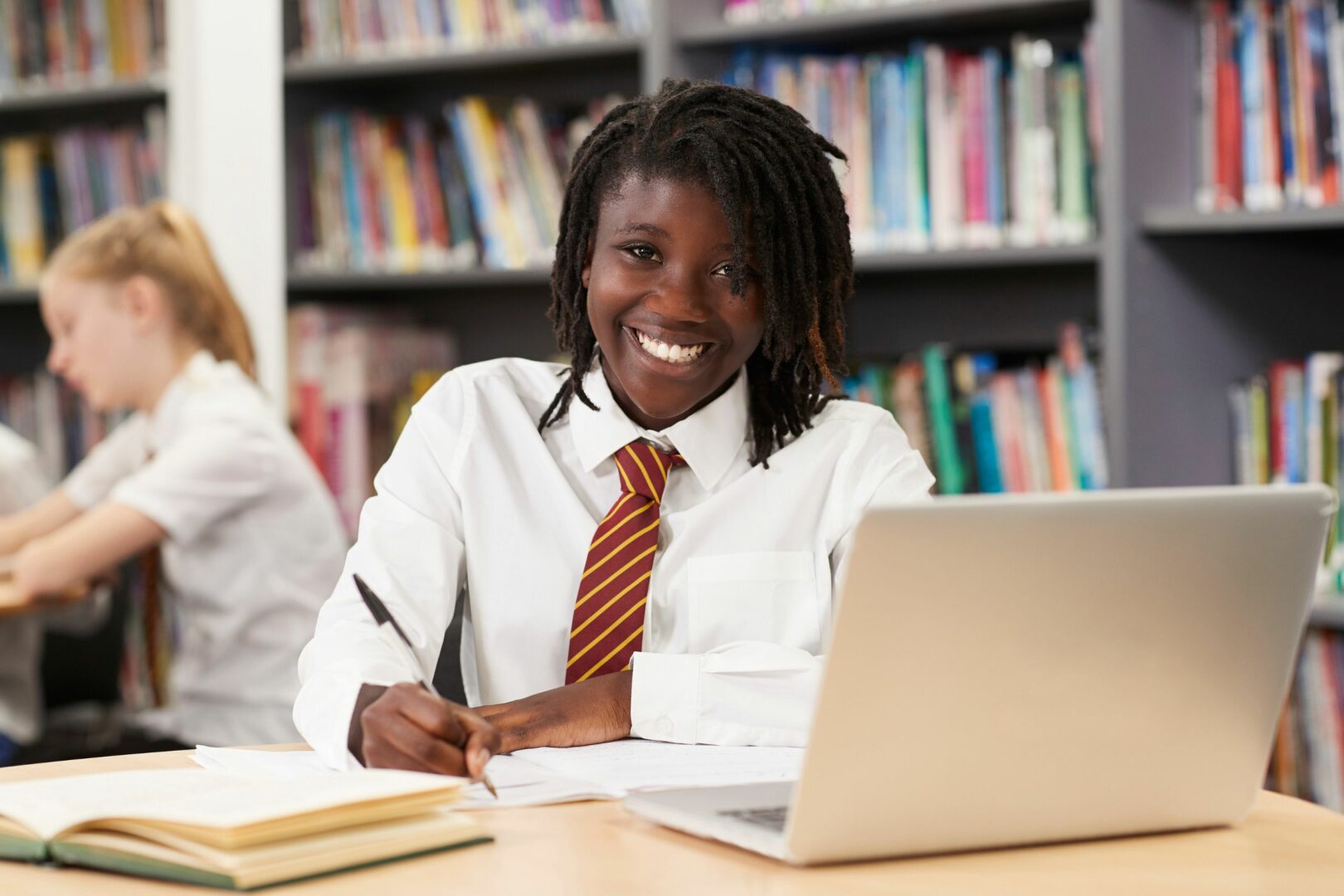 School pupil looking at laptop