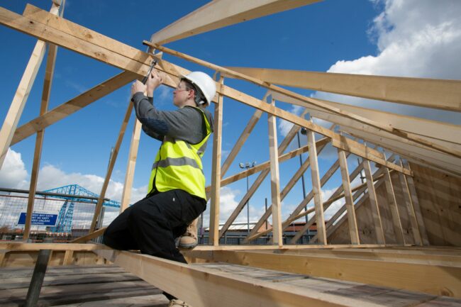 Student building on wooden frame
