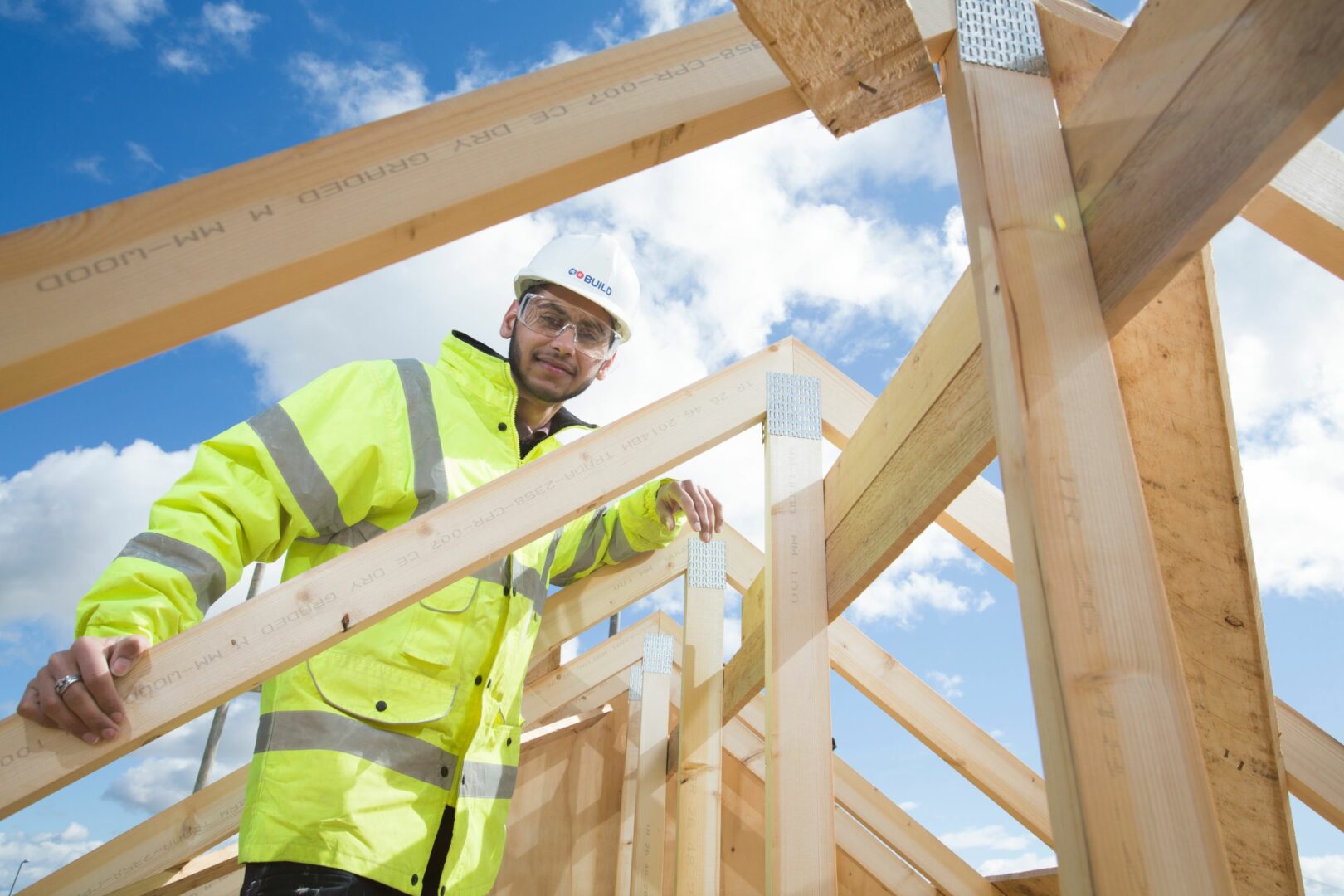 Construction student on wooden frame