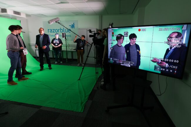 Students in greenscreen room