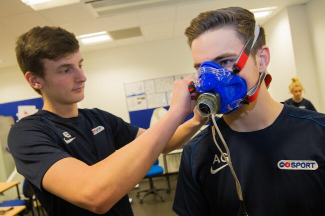 Sports science students with equipment