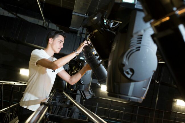 Student with stage light