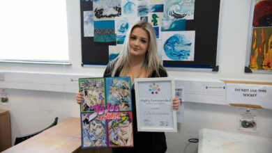 Lila Richardson holding artwork and certificate