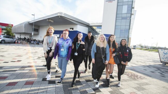 Students walking through college campus