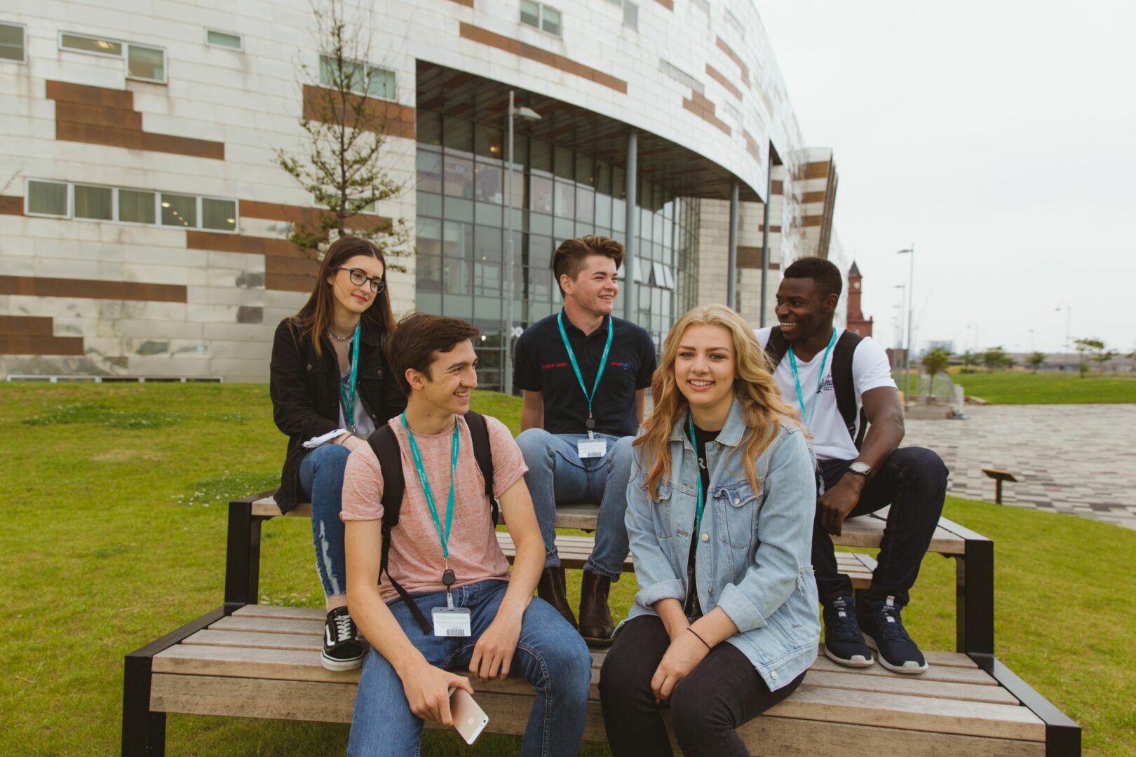 Students sitting outside College building