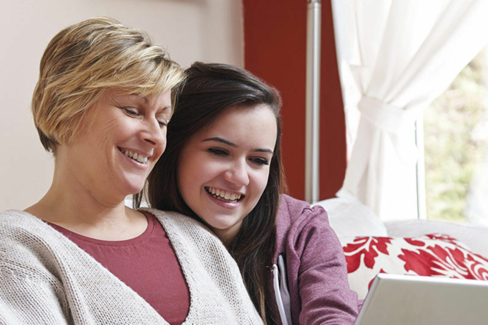 Mother and daughter looking at computer