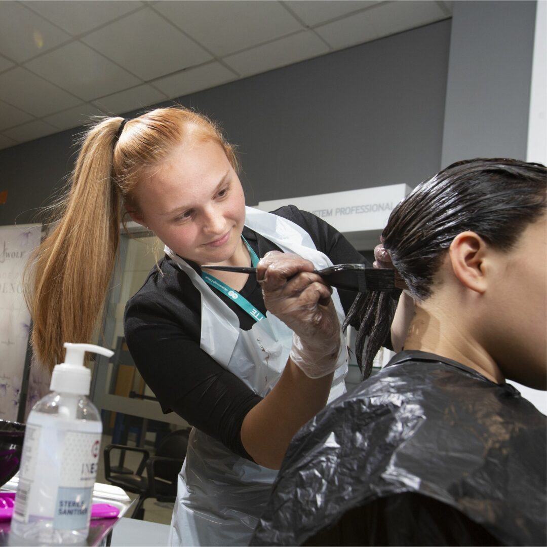 Student dyeing hair