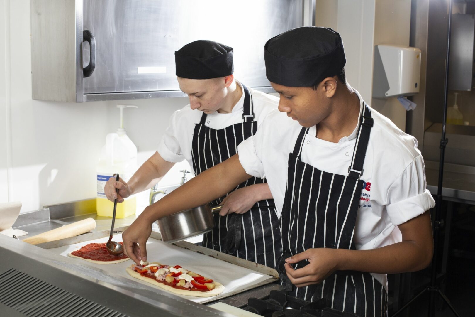 Catering students preparing pizza