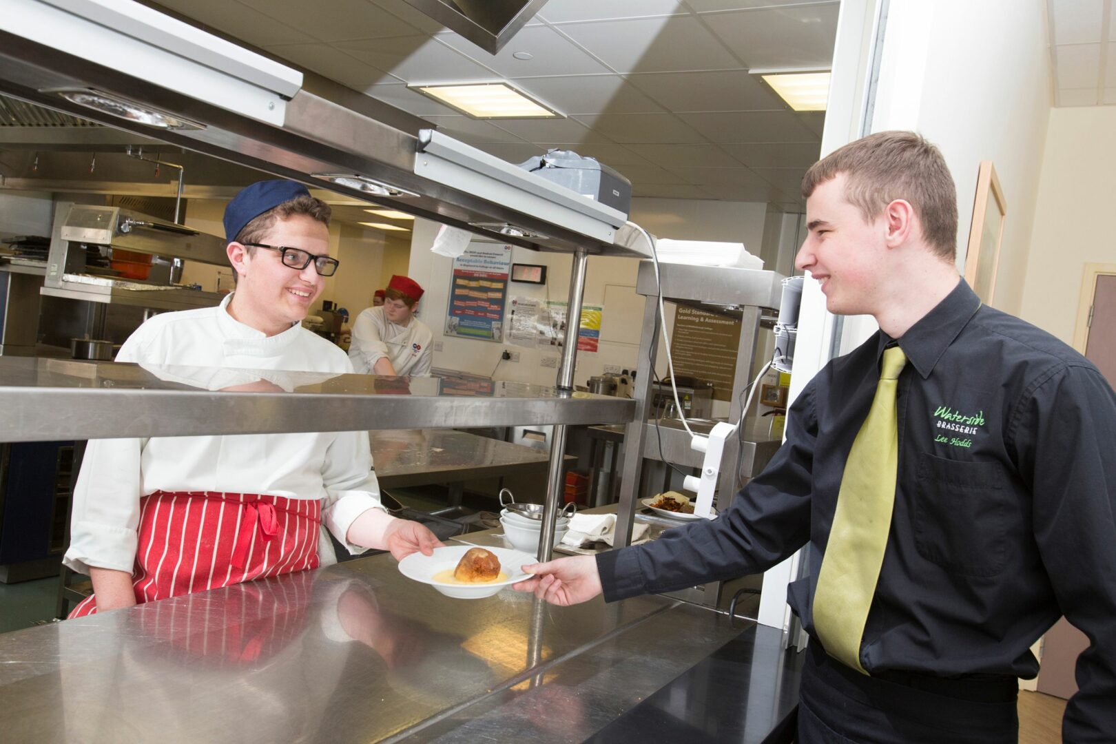 Catering and hospitality students in restaurant