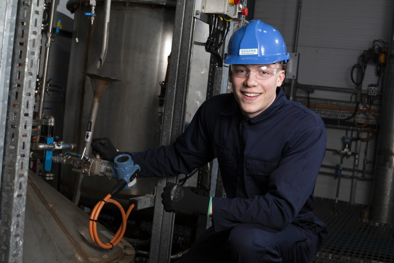 TTE student working on machinery