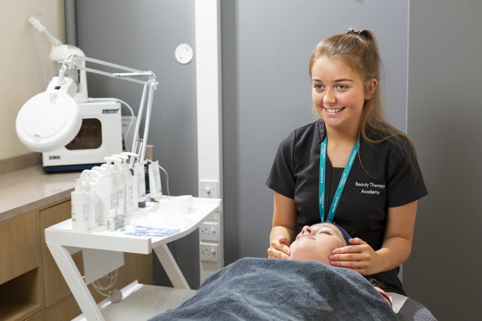 Beauty therapy student giving facial