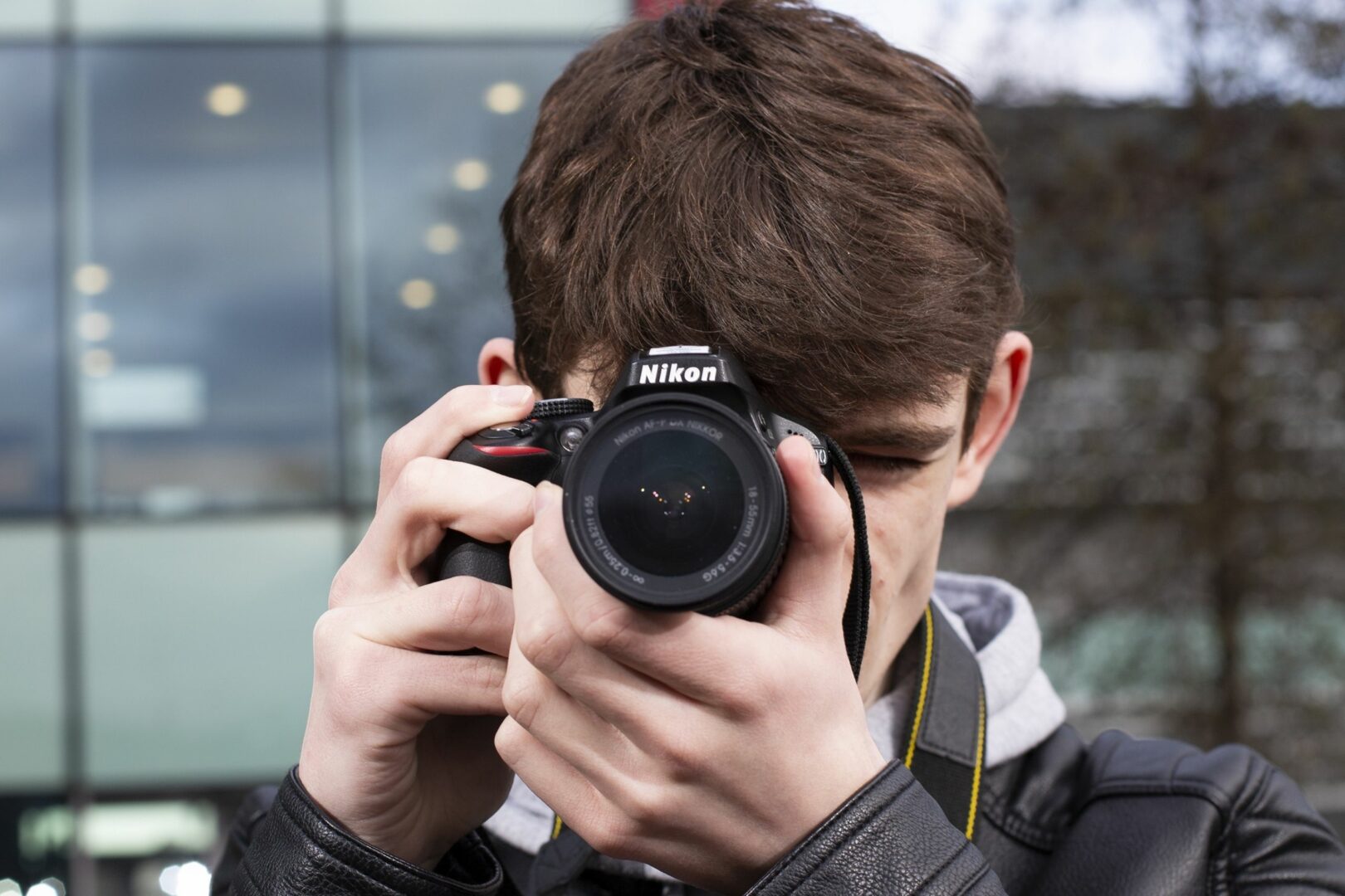 Student holding camera