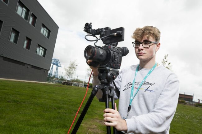 Media student with camera