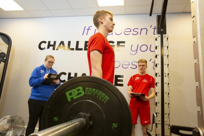 Sports student lifting weight