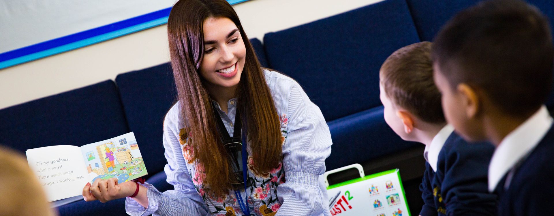 Teaching student reading book to children