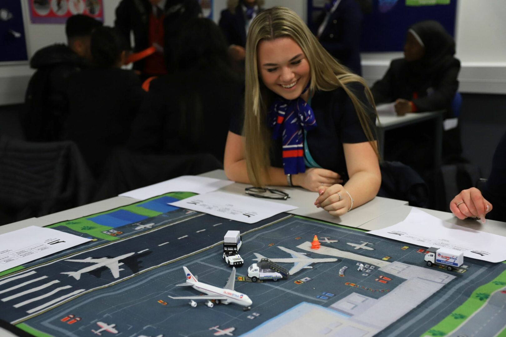 Travel student with model airport