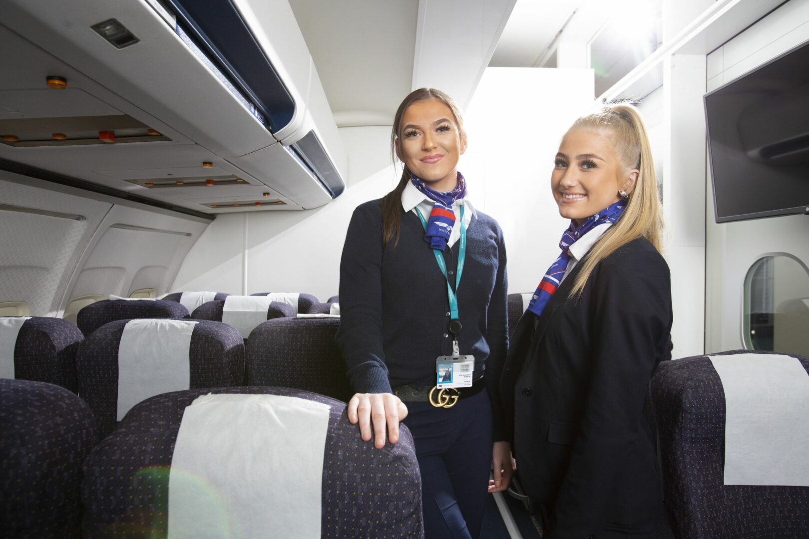 Two travel students in aircraft