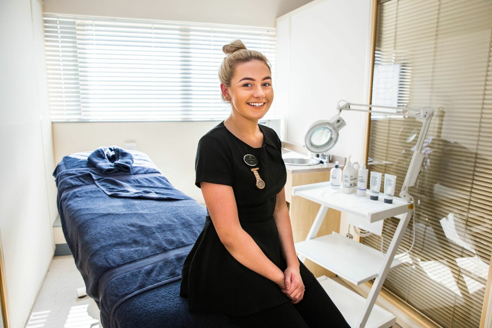 Beauty apprentice sitting in beauty therapy room