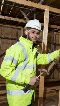 Construction student holding hammer