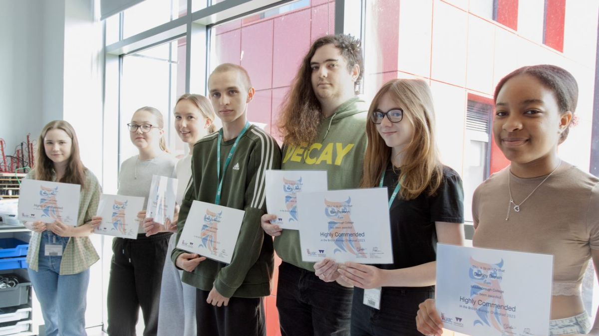 Students holding certificates