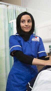 Healthcare student in nurse tunic