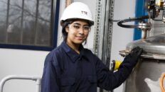 TTE student next to process equipment