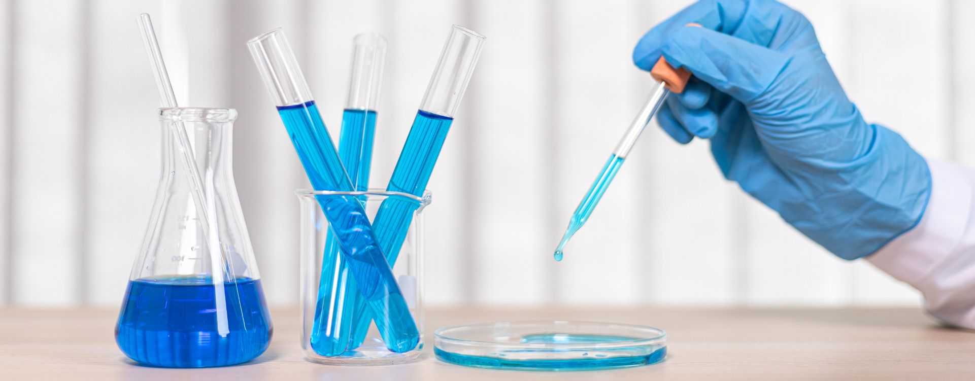 Laboratory beakers with blue liquid