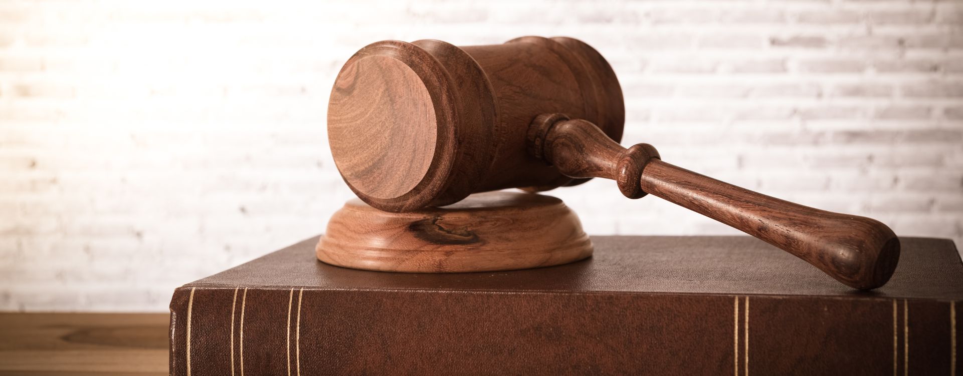 Wooden gavel on book
