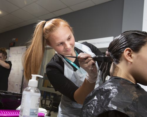 Hair student dyeing hair