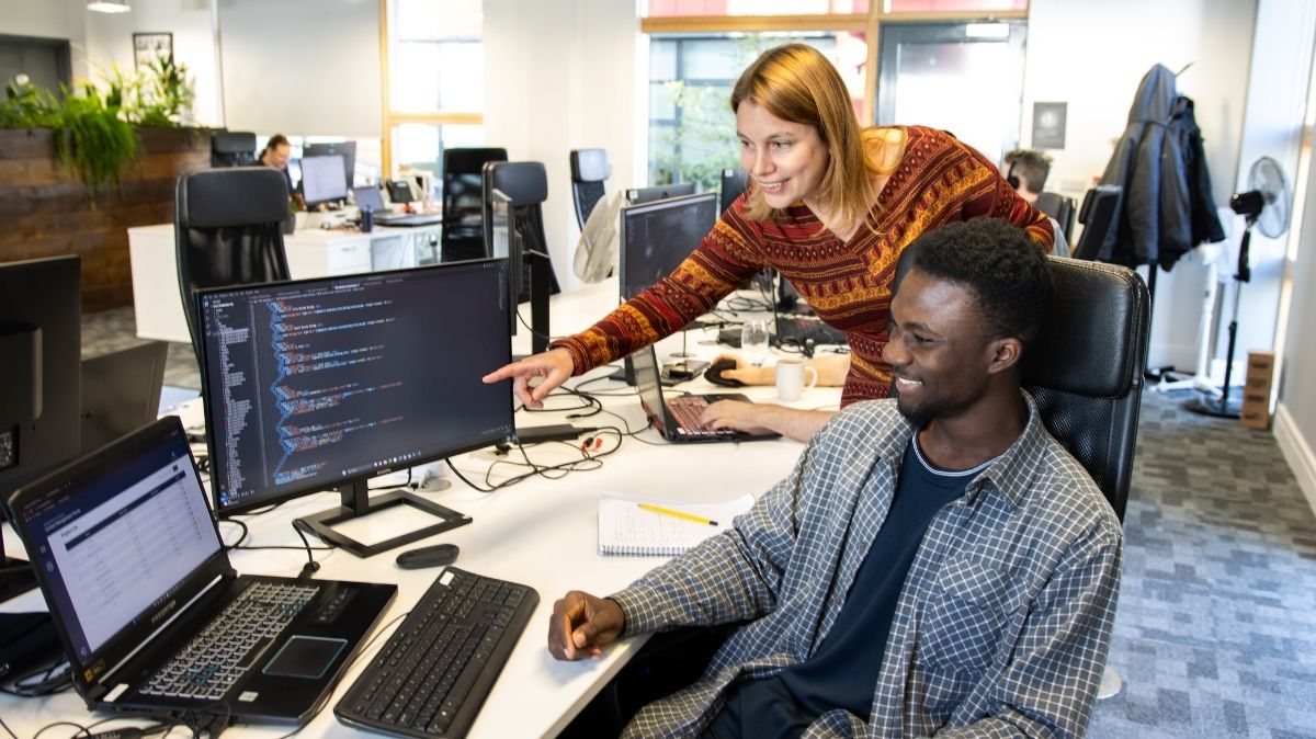 People looking at computer