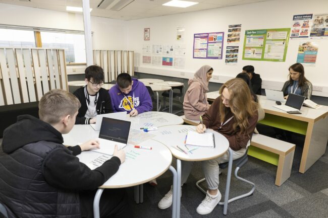 Business students working in classroom