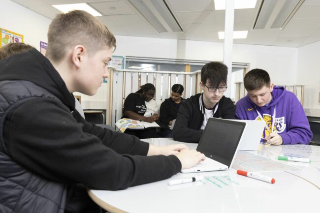 Business students working in classroom