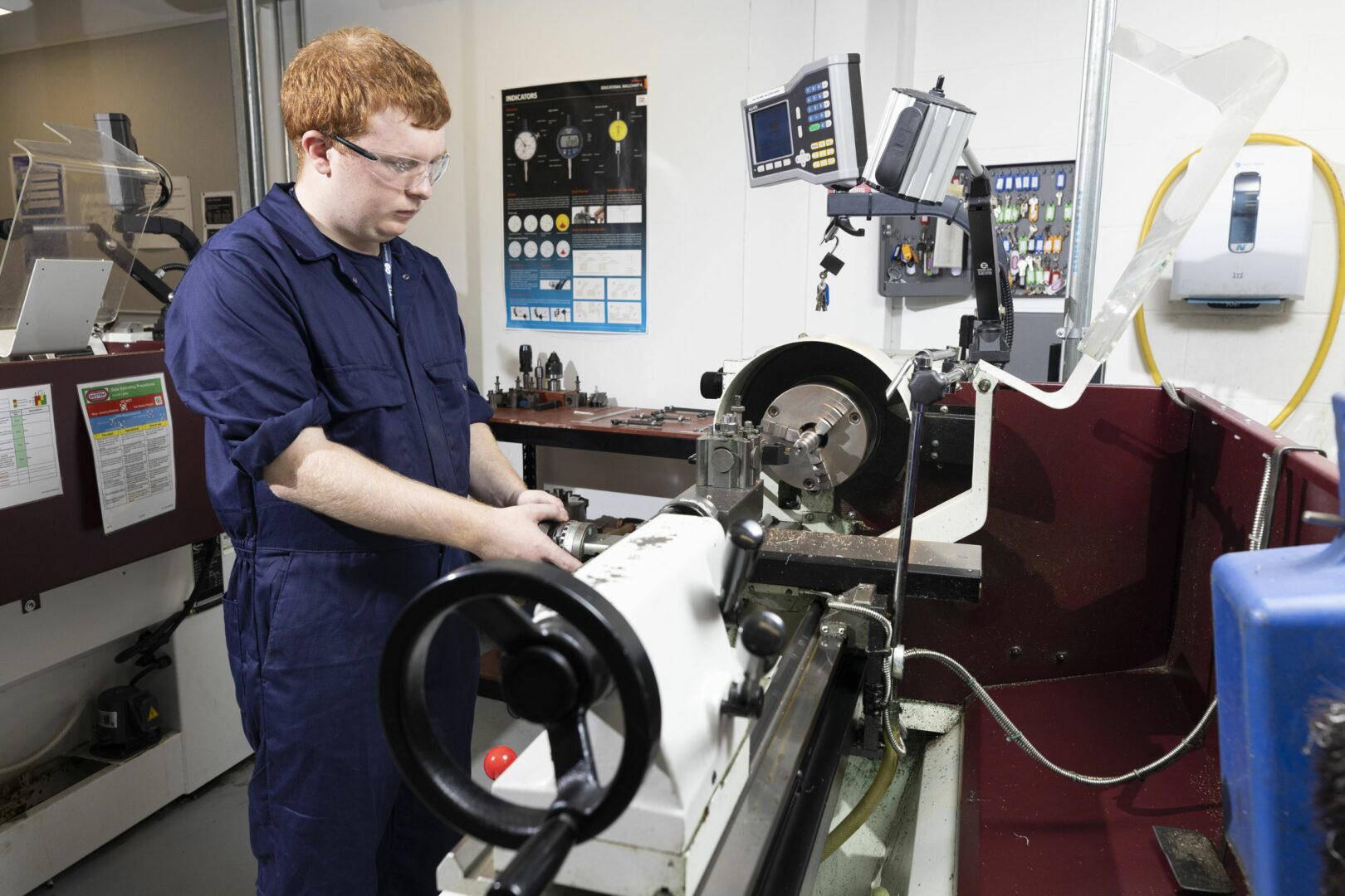 Engineering student working on mechanical equipment