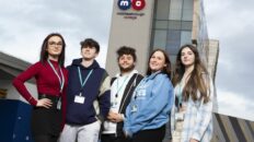 Five students standing outside Middlesbrough college building