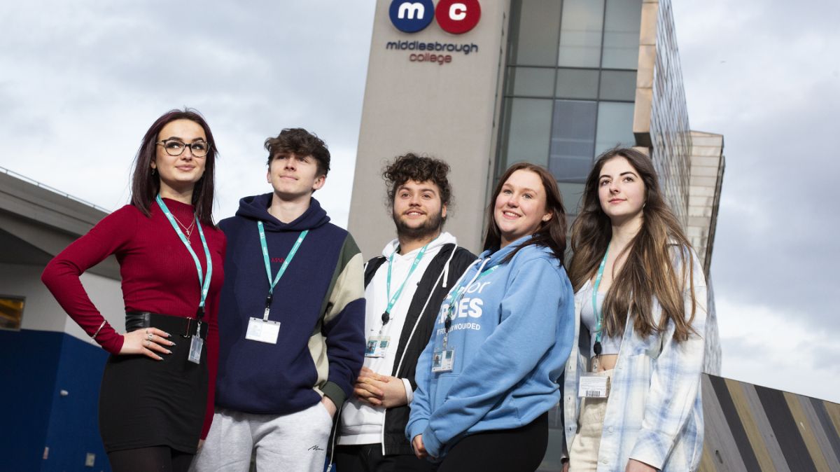 Five students standing outside Middlesbrough college building