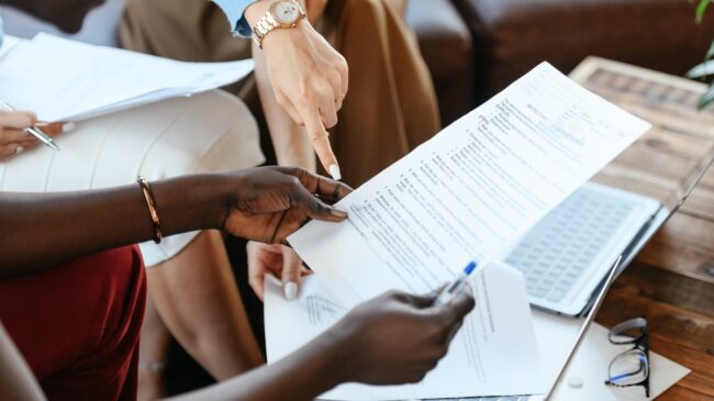 Hands looking at a document