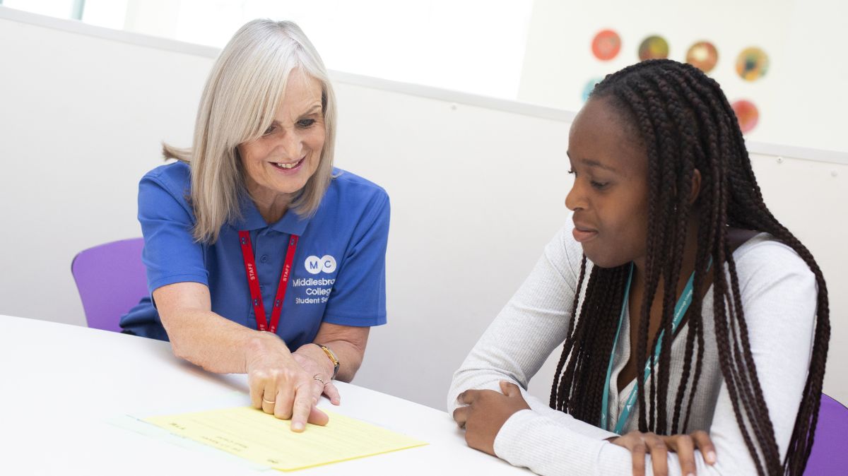 Support Staff member with student