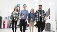 Students Walking Down Corridor