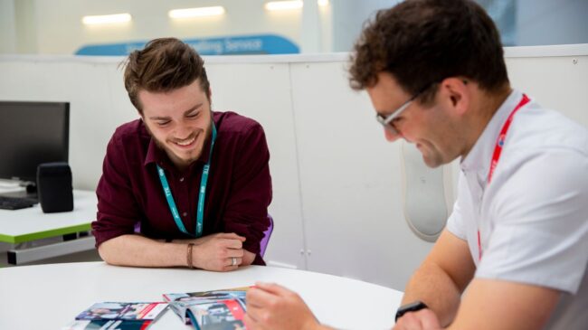 Careers team member talking to student
