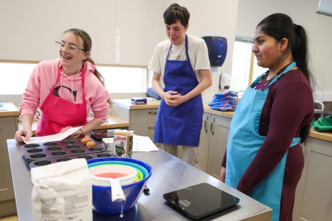 Inclusive Learning students baking in kitchen
