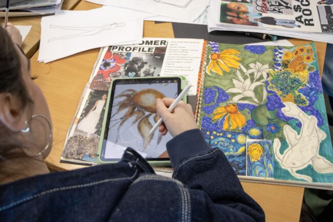 Student designing sunflowers