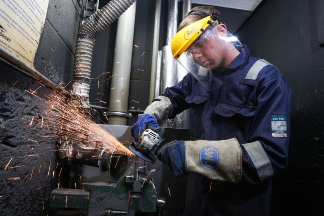 Student using grinder
