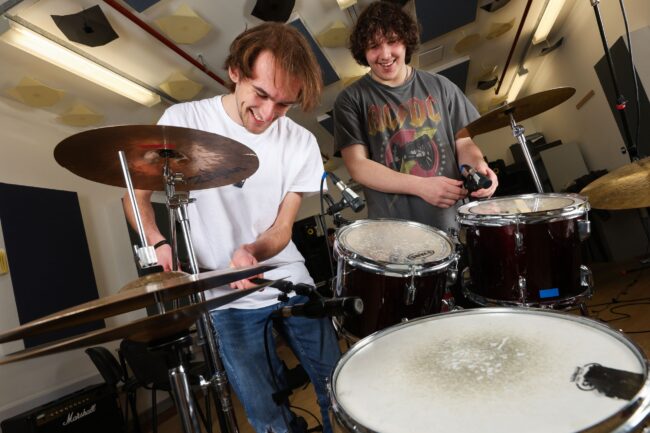 Student Setting Up Drums