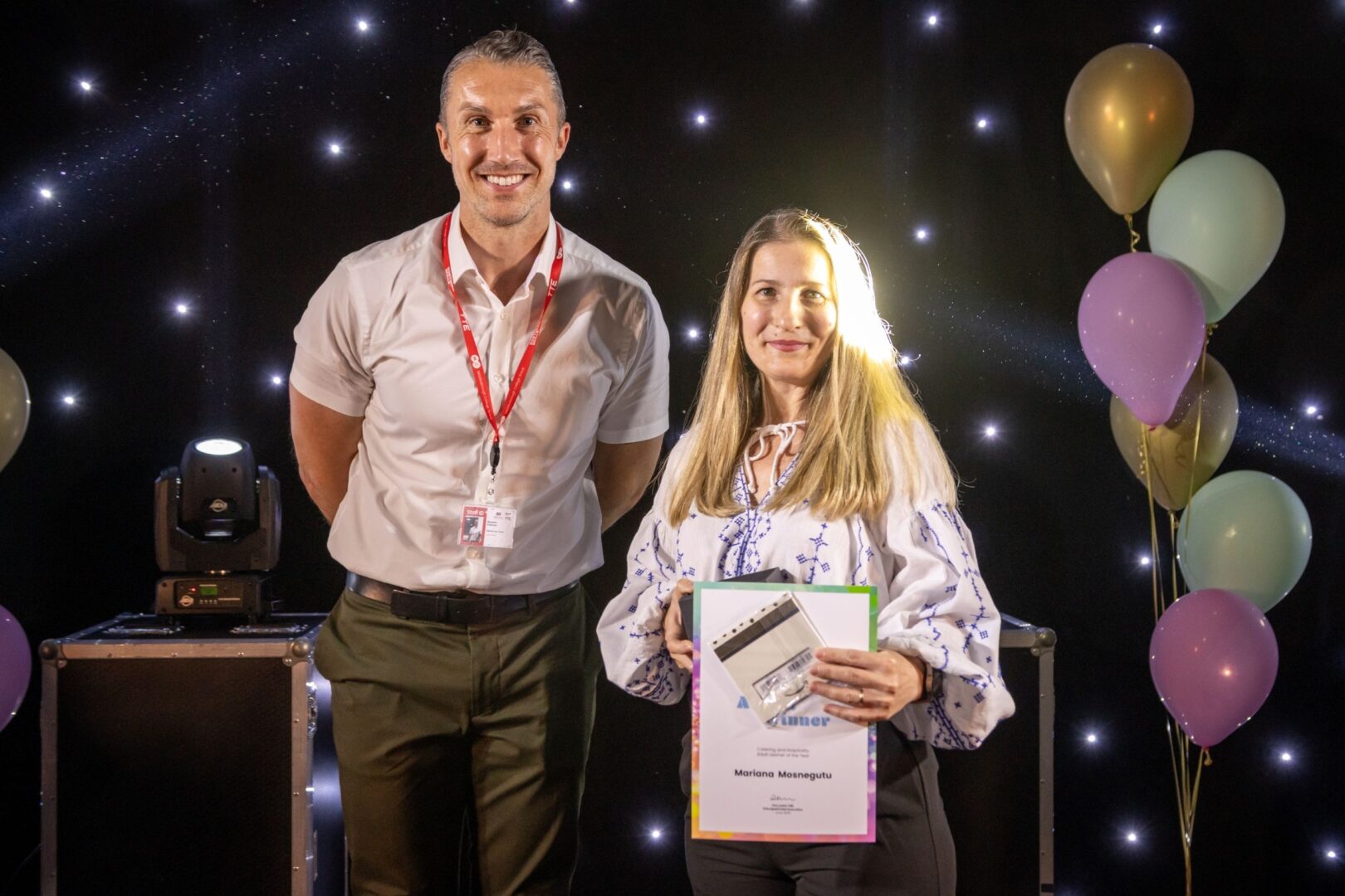 Ben Robinson Of MC With Catering And Hospitality Adult Winner Mariana Mosnegutu